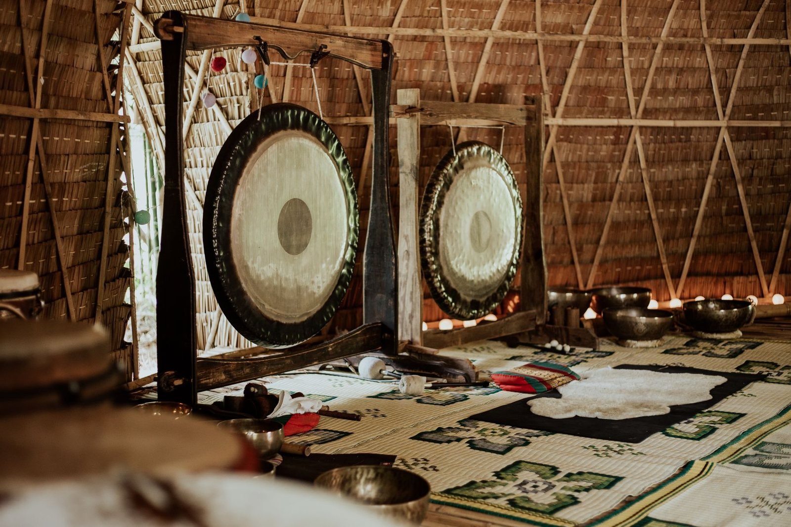 A warm meditation room with gongs and Tibetan singing bowls